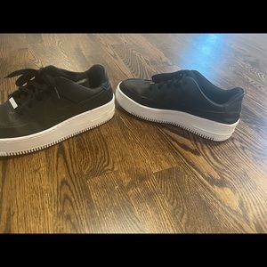 Black leather Air Force ones